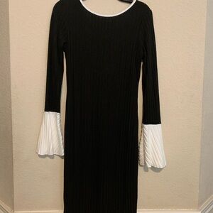 Black Dress with White Bell Sleeves, Bows in back, size large.